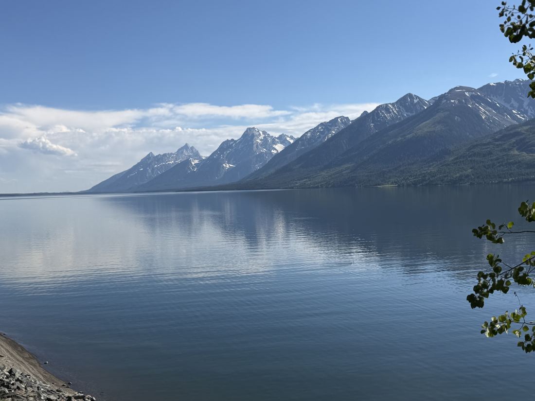 The Teton Range reflected across Jackson Lake